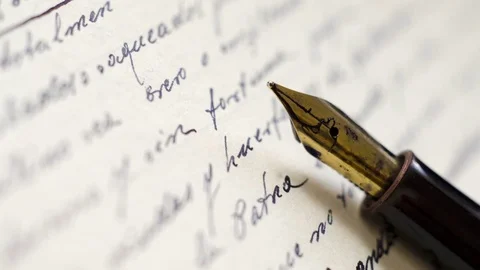 Close up of fountain pen on old letter Stock Footage