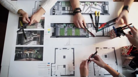 Close Up Of four Architects Discussing Plan Together At Desk timalaps Stock Footage 56949686