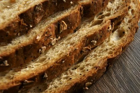 Close-up of a fragment of a bread bribe. Fresh slices of bread. Stock Photos