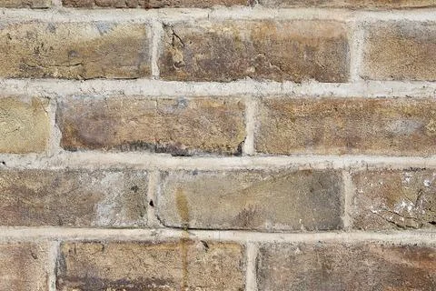 Close-up fragment of wall with old brickwork on cement mortar. 写真素材