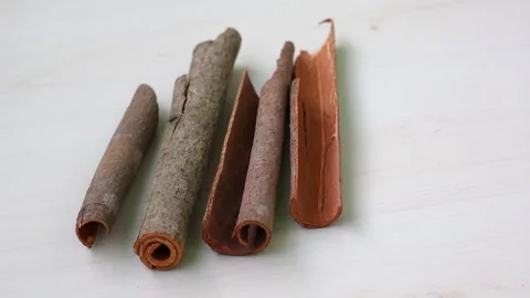 Close-up of fragrant cinnamon sticks, a warm and inviting spice. Stock Footage 317867415