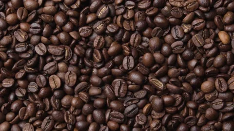 Close up of fragrant coffee beans are roasted smoke comes from coffee beans. Stock Footage 147875827