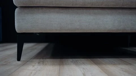 Close up frame. The legs of a gray sofa. Stock Footage 231507673