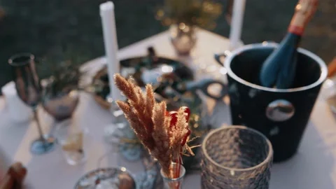 The close frame of a natural setting, the table decorated with romantic elements Stock Footage 154684181