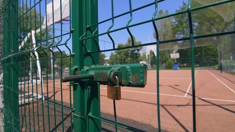 Close frame on padlock, closed playground with padlock to prevent the spread  库存影片 129524021