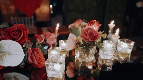 Close frame of the perfect decor, a table decorated with pink, red roses and Stock Footage 155627205