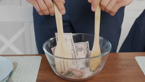 Close up frame of the plate with money processed by a freaky businessman Vídeos de archivo 144021755