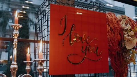 Close frame of the romantic, red panel that says i love you, a panel that shines Stock Footage 155627112