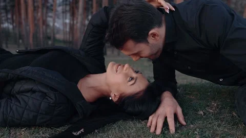 The close frame, in slow motion, of the young people in love, she lies down and Stock Footage 154683260