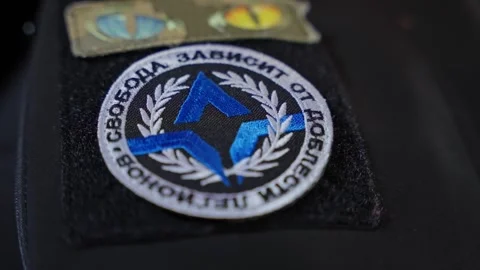 Close-up of the Freedom of Russia Legion patch attached to dark fabric Stock Footage 304588403