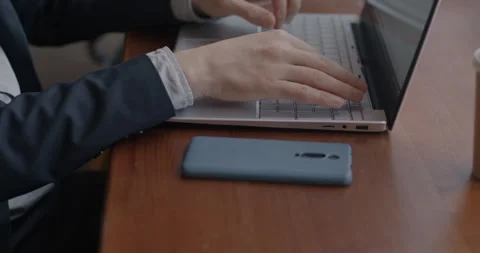 Close-up of freelance programmer working with laptop computer coding typing Stock Footage 281820039