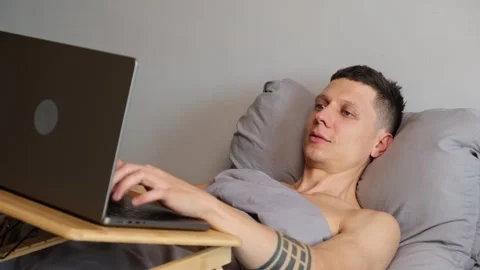 Close up of freelancer closing laptop smiling with satisfaction after completing Stock Footage 314893274