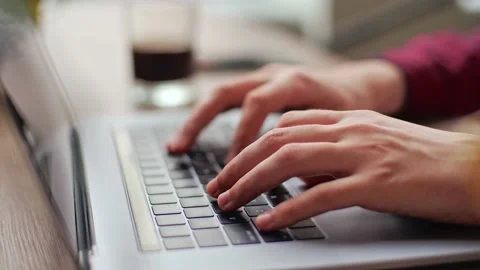 Close up of freelancer's developer hands typing program code on laptop keyboard Stock Footage 217734435