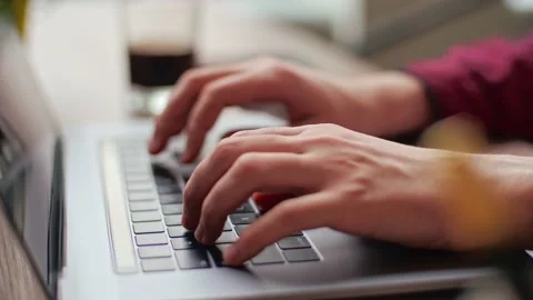 Close up of freelancer's developer hands typing program code on laptop keyboard Stock Footage 219603136