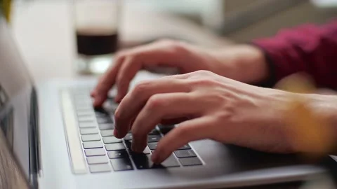 Close up of freelancer's developer hands typing program code on laptop keyboard Stock Footage 220725793