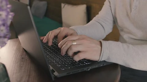 Close up of freelancer's developer hands typing program code on laptop keyboard Stock Footage 269994347