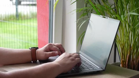 Close up of freelancer's developer hands typing program code on laptop keyboard  Stock Footage 278045298