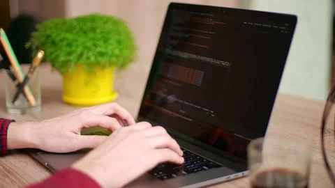 Close up of freelancer's hands typing code on laptop keyboard. Camera slides Video stock 220072853