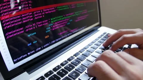 Close up of freelancer's hands typing code on laptop Web application 库存影片 334585803
