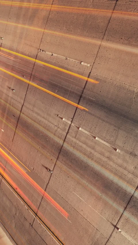 Close-up freeway from above at night timelapse abstract light trails asphalt 스톡 동영상 342878107