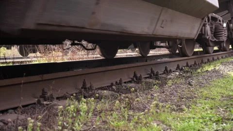 Close-up of freight train rolling stock. Loaded hopper cars moving. Stock Footage 307555871