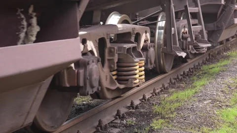 Close-up of freight train rolling stock. Loaded hopper cars moving. Stock Footage 308486196