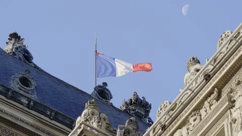 Close up of the French Flag Blowing in the Wind over a building in Paris - 4K Video stock 164042785