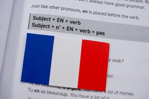 Close up of French flag on language learning book Stock Photos