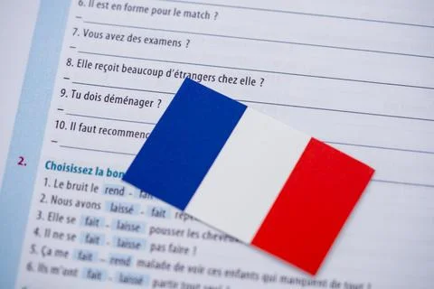 Close up of French flag on language learning book Stock Photos