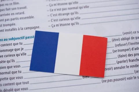 Close up of French flag on language learning book Stock Photos