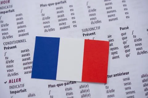Close up of French flag on language learning book Stock Photos