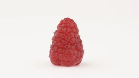 A close-up of fresh and tasty raspberry rotating. Isolated, on white background. Stock Footage 112945775