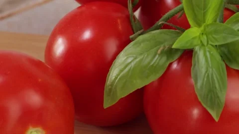 Close-up of fresh basil on ripe tomatoes. Stock Footage 340329432