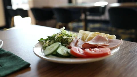 Close up of fresh breakfast platter with ham, cheese and cucumber slices. Stock Footage 340341761