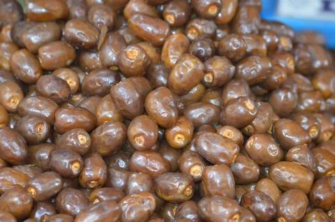 Close-Up of Fresh Brown Dates Piled High, Showcasing Their Natural Sweetness Stock Photos