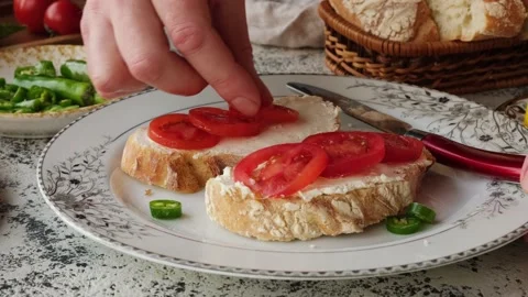 Close-up of fresh cherry tomato bruschetta with cream cheese. Stock Footage 236608629