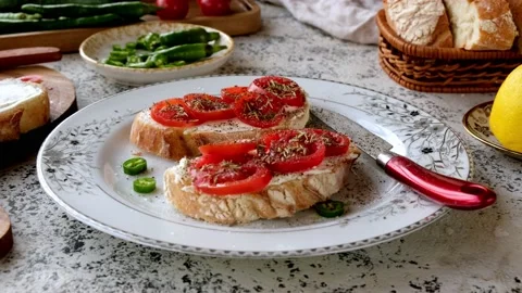 Close-up of fresh cherry tomato bruschetta with cream cheese. Stock Footage 237384849