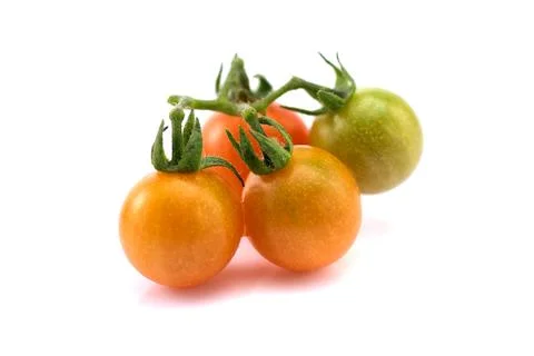 Close up of fresh cherry tomato isolated on white background. Stock Photos