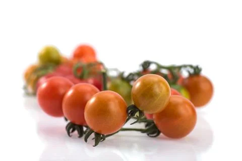 Close up of fresh cherry tomato isolated on white background. Stockfoto's