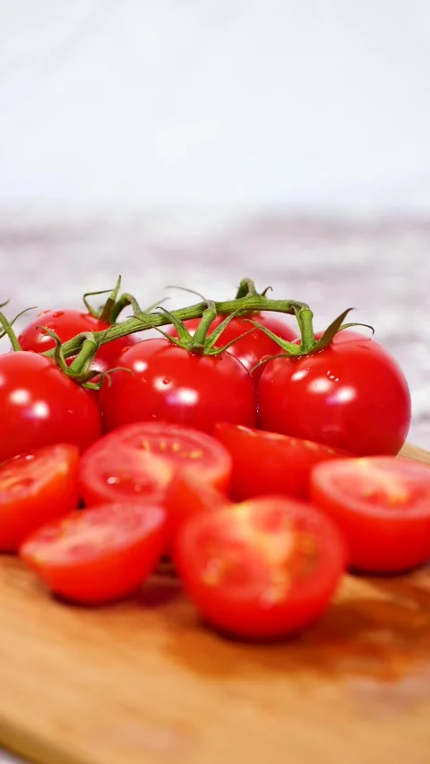 Close-up of fresh cherry tomatoes, follow focus, vertical 4k video Stock Footage 281966619