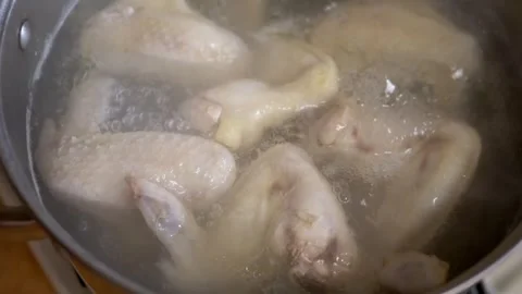 Close up, Fresh Chicken Wings are Boiling in Water Stock Footage 314218558