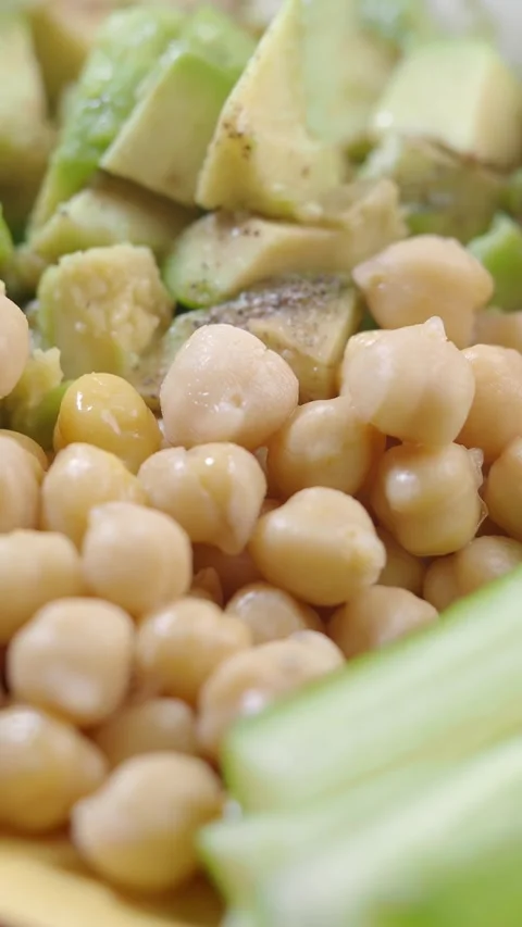 Close up of fresh chickpeas and avocado in healthy salad with quinoa. Stock-Footage 332113675