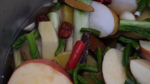 Close-up of Fresh Chopped Ingredients Simmering in a Cooking Pot Video stock 343588055
