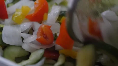 Close-up of Fresh Chopped Vegetables with Cucumbers, Bell Peppers, and Onions Stock-Footage 347688725