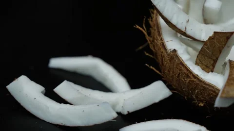 Close-up of fresh coconut pieces and half coconut, Fresh coconut pieces on .. Vídeo Stock 339022723