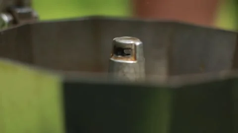 Close Up of Fresh Coffee Brewing in Stainless Steel Moka Pot Stock Footage 337909051