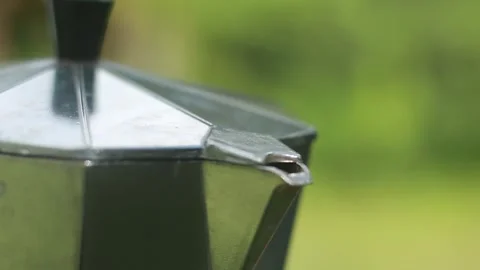 Close Up of Fresh Coffee Brewing in Stainless Steel Moka Pot Stock Footage 337909239
