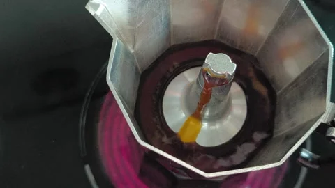 Close-up of fresh coffee bubbling inside a Moka pot Stock Footage 318356562