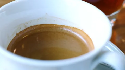 Close up of fresh coffee in cup on table. Stock Footage 240272309