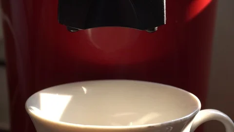 Close up of fresh coffee poured into a white mug on red background Stock Footage 113011973